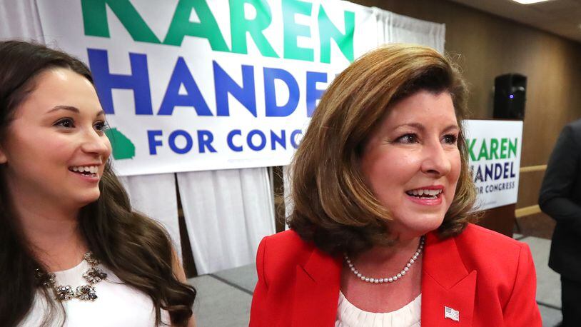 April 18, 2017, Roswell: Republican candidate Karen Handel arrives to work a room full of supporters during her election night viewing party in the special election for Georgia's 6th Congressional district at the Double Tree Hotel on Tuesday, April 18, 2017, in Roswell.  Curtis Compton/ccompton@ajc.com