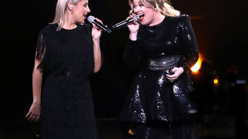 Kelly Clarkson with backup singer Jessi Collins.