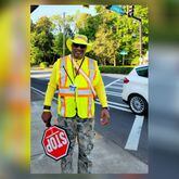 School crossing guard Jeffery Smith was back at work in Decatur on Monday after he was injured in a crash in September, police said.