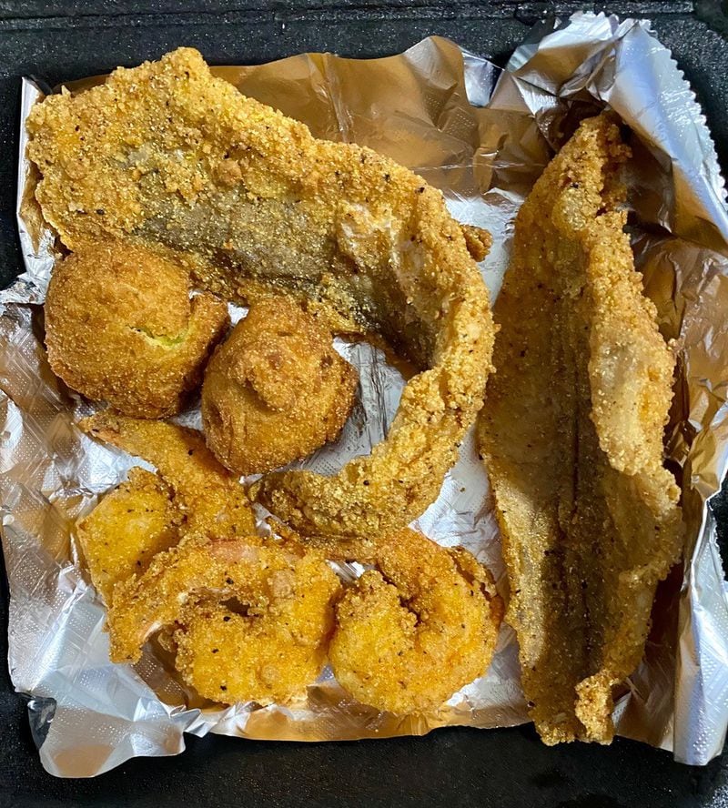Who’s Got Soul offers fried seafood, including this combo with whiting, catfish, shrimp and hush puppies. Wendell Brock for The Atlanta Journal-Constitution