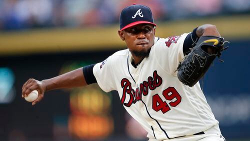 Atlanta Braves starting pitcher Julio Teheran (49) delivers in the first inning of a baseball game against the Philadelphia Phillies Saturday, July 30, 2016, in Atlanta. (AP Photo/John Bazemore)