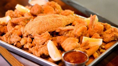 The Heartstopper Fried Feast at Bon Ton includes crawfish, oysters, shrimp, catfish, Cajun fries and hush puppies. CONTRIBUTED BY HENRI HOLLIS