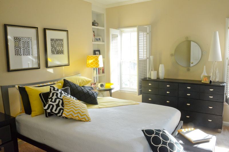 Plantation shutters and modern furniture mix in Pedro Ayestaran Diaz's and Jeffrey Chandler's master bedroom. The homeowners bought their end-unit Vinings townhome in spring 2015 and have decorated it with an eclectic interior design style. Text by Lori Johnston and Keith Still/Fast Copy News Service. (Christopher Oquendo Photography/www.ophotography.com)