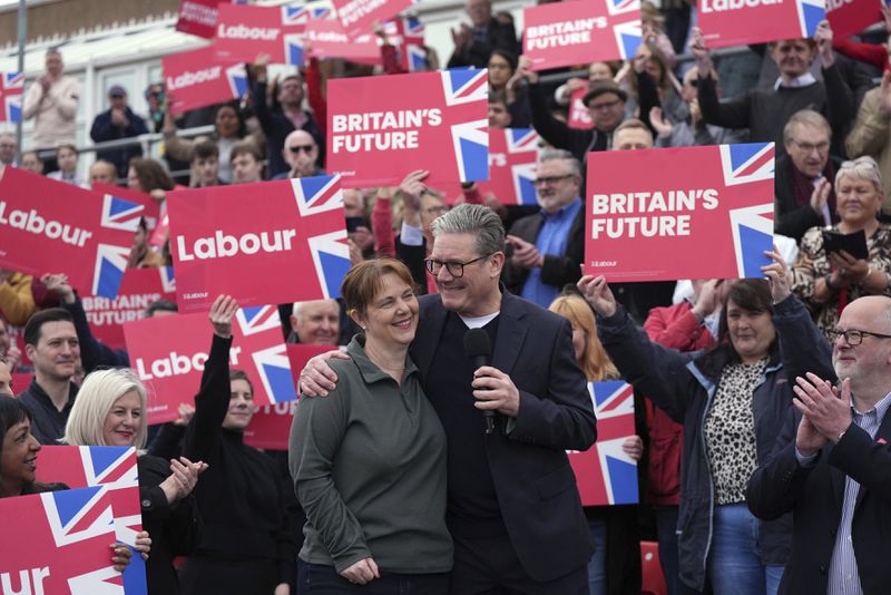 Britain's Labour Party leader Sir Keir Starmer with newly elected East Midlands mayor Claire Ward during a visit to Forest Town Arena in Mansfield, England, Saturday May 4, 2024. (Jacob King/PA via AP)