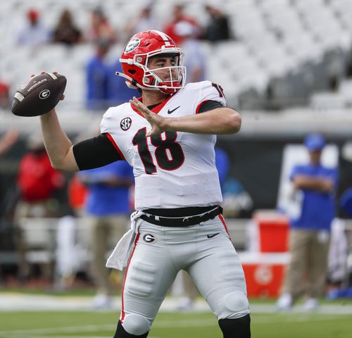10/30/21 - Jacksonville -  Georgia Bulldogs quarterback JT Daniels (18) warms up before the game at the annual NCCA  Georgia vs Florida game at TIAA Bank Field in Jacksonville.   Bob Andres / bandres@ajc.com