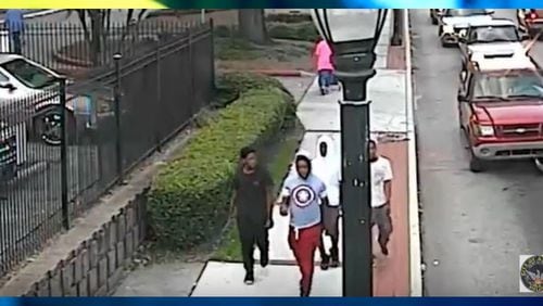 Atlanta police officers are looking for those pictured in this surveillance image in connection with a deadly carjacking. (Credit: Atlanta Police Department)