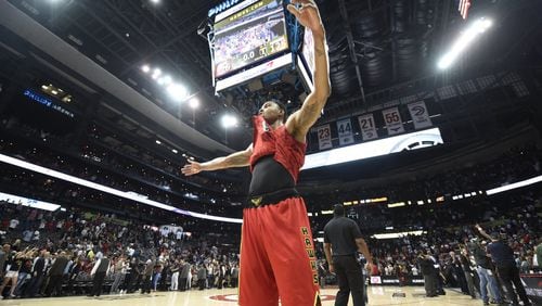 The Hawks’ Kent Bazemore raises his arms in victory after his team defeated the Cleveland Cavaliers at Phillips Arena on April 9, 2017. The Hawks won in overtime 126-125 after coming back from 26 points down in the fourth quarter. (Henry Taylor/henry.taylor@ajc.com)