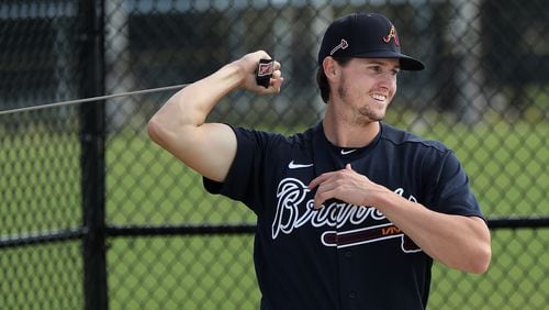 Braves pitcher Kyle Wright loosens up his throwing arm Sunday, Feb. 16, 2020, at spring training camp at CoolToday Park in North Port, Fla.