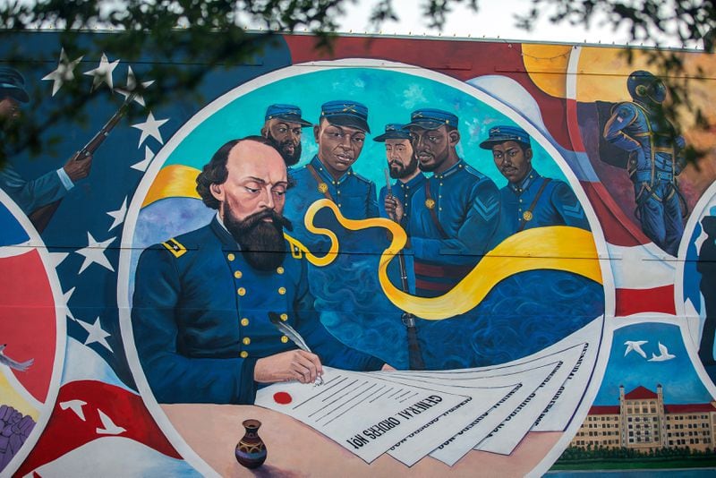 A 5,000-square-foot mural created by Reginald C. Adams, at the spot where Gen. Gordon Granger issued the orders that resulted in the freedom of more than 250,000 enslaved Black people in the state, in Galveston, Texas, on May 5, 2021. On June 19, 1865, a Union general issued an order that led to the freeing of slaves in Texas and a new mural will now mark the spot where it happened.(Montinique Monroe/The New York Times)