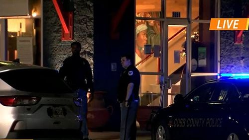 Cobb County police investigated a shooting Tuesday night outside a restaurant on Akers Mill Road.