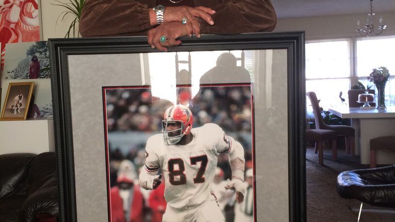 Claude Humphreyat his home this week (Jan. 2014) and portrait of himself w/ the Falcons. Steve Hummer / shummer@ajc.com
