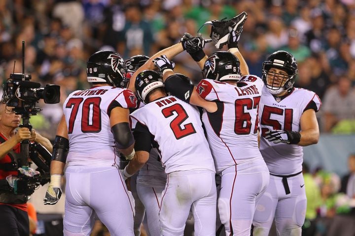 Photos: Falcons fall to Eagles in season opener