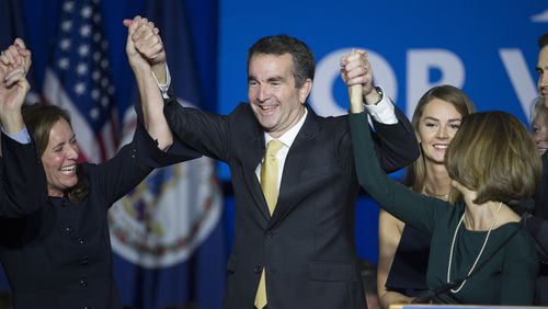 Virginia Gov.-elect Ralph Northam celebrates his election victory with his wife Pam and daughter Aubrey, right, and Dorothy McAuliffe, wife of Virginia Gov. Terry McAuliffe at the Northam For Governor election night party at George Mason University in Fairfax, Va., Tuesday, Nov. 7, 2017.