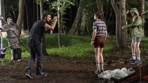 Director Shawn Levy shooting "Stranger Things" actors Noah Schnapp and Finn Wolfhard during season 3. Tina Rowden/Netflix
