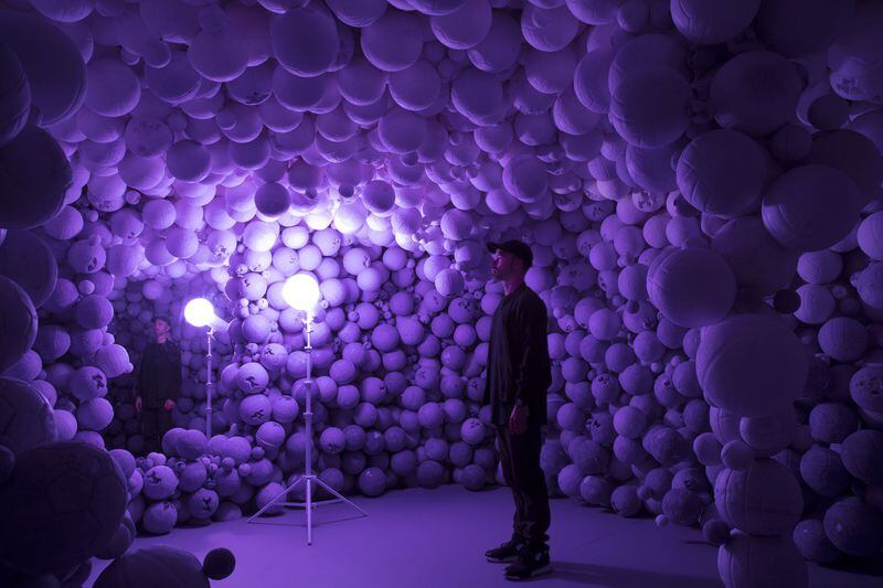 “Amethyst Sports Ball Cavern,” with artist Daniel Arsham at the center, is an installation using amethyst crystal, quartz and hydrostone featured in “Daniel Arsham: Hourglass” at the High Museum of Art. CONTRIBUTED BY GALERIE PERROTIN / PHOTO BY GUILLAUME ZICCARELLI