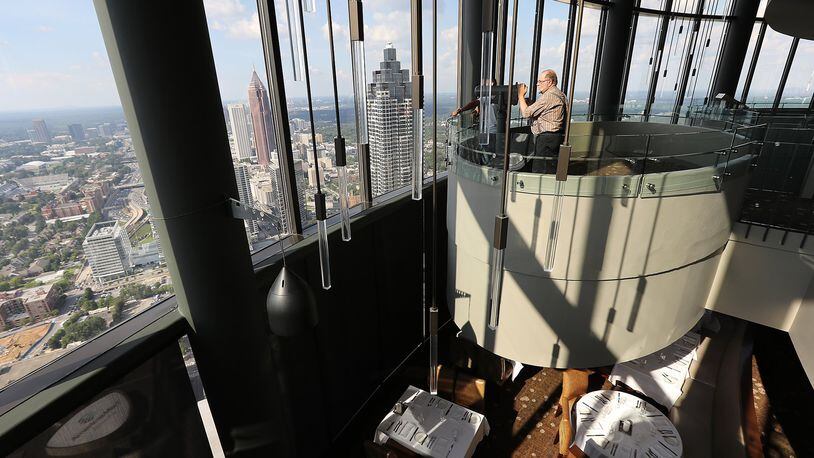A visitor from South Dakota takes in the view of Atlanta from The Sun Dial Restaurant during an August visit to Atlanta. (CURTIS COMPTON /ccompton@ajc.com)