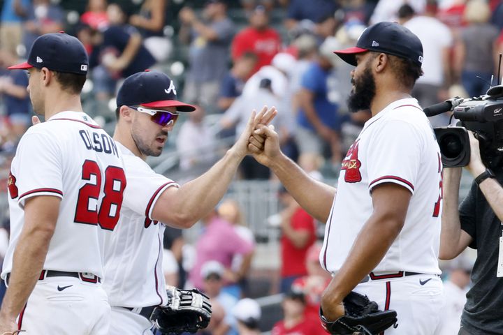 Atlanta Braves right fielder Adam Duvall celebrates with closer Kenley Jansen (right) on Sunday, June 12, 2022. The Braves completed a sweep against the Pirates, extending their winning streak to 11. (Miguel Martinez / miguel.martinezjimenez@ajc.com)
