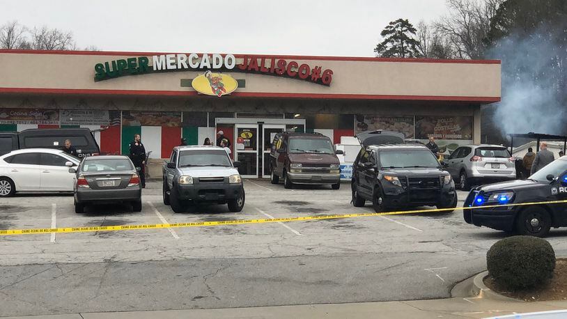 A man was shot and killed Saturday afternoon in the parking lot of a Roswell supermarket, police said.