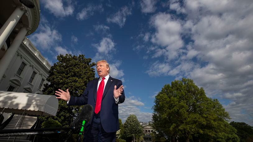 FILE - In this May 1, 2020, file photo President Donald Trump speaks with reporters as he departs the White House in Washington. (AP Photo/Alex Brandon, File)