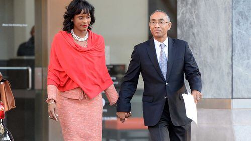 DeKalb CEO Burrell Ellis and his wife, Philippa, head to a press conference Dec. 1 where he spoke for the first time since he was convicted a year and a half ago following a second trial in DeKalb County. The Georgia Supreme Court threw out Ellis’ guilty verdicts on Nov. 30. KENT D. JOHNSON/kdjohnson@ajc.com