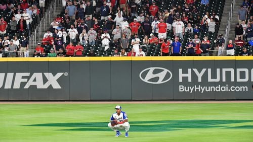 Braves center fielder Cristian Pache (25) watches as Philadelphia Phillies third baseman Alec Bohm (28) scores to give the Phillies a 7-6 lead in the ninth inning Sunday, April 11, 2021, at Truist Park in Atlanta. Atlanta argued Bohm didn't score on the play. (Hyosub Shin / Hyosub.Shin@ajc.com)