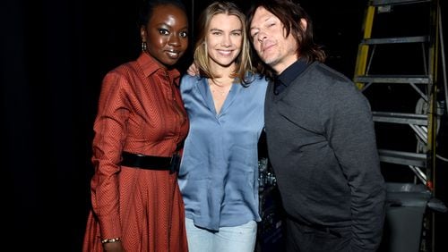 NEW YORK, NEW YORK - OCTOBER 05: (L-R) Danai Gurira, Lauren Cohan, and Norman Reedus pose backstage at a panel for AMC's The Walking Dead Universe including AMC's flagship series and the untitled new third series within The Walking Dead franchise at Hulu Theater at Madison Square Garden on October 05, 2019 in New York City. (Photo by Jamie McCarthy/Getty Images for AMC)