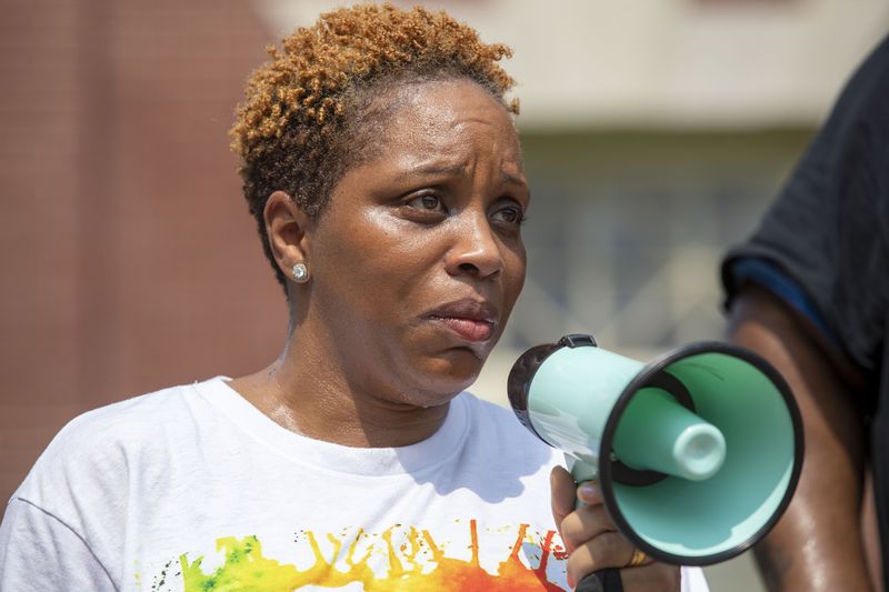 07/26/2021 — Newnan, Georgia — Ayisat Idris-Hosch, president of Newnan’s African American Alliance, becomes emotional at a rally outside of the Coweta County Historic Courthouse in Newnan, Monday, July 26, 2021. (Alyssa Pointer/Atlanta Journal-Constitution)