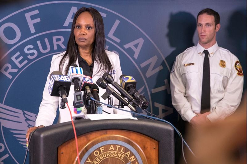 04/05/2018 -- Atlanta, GA - Fulton County Chief Medical Examiner Jan Gorniak, center, answers questions during a press conference at the Atlanta Police Department headquarters, Thursday, April 5, 2018. The medical examiner's office broke the news to the family of missing CDC researcher Timothy Cunningham, that his body was found in the Chattahoochee River.  ALYSSA POINTER/ALYSSA.POINTER@AJC.COM