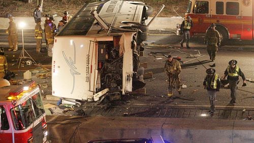 A charter bus, reportedly carrying members of a baseball team from Ohio, crashed onto I-75 from an overpass at Northside Drive early Friday morning, March 2, 2007. (JOHN SPINK/AJC staff)