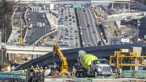 January 12, 2022 Atlanta: Like the weather, The new I-285 interchange at Ga. 400 continues to change with new detours and ramps as the project continues on Wednessday, Jan. 12, 2022. The interchange was supposed to be open to traffic by the end of 2021. The contractor on the project has said that the work could drag on until the third quarter of 2022. That may be little comfort for motorists who have been living with orange barrels since major construction began in 2017.. (John Spink / John.Spink@ajc.com)