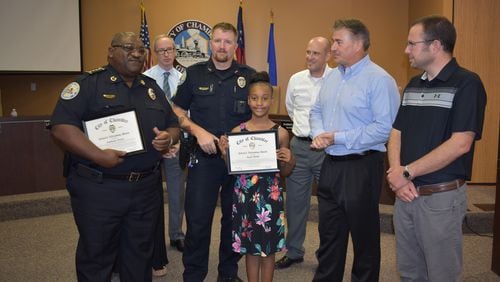 Jayla Dallis (center) was honored by the Chamblee City Council on Wednesday.