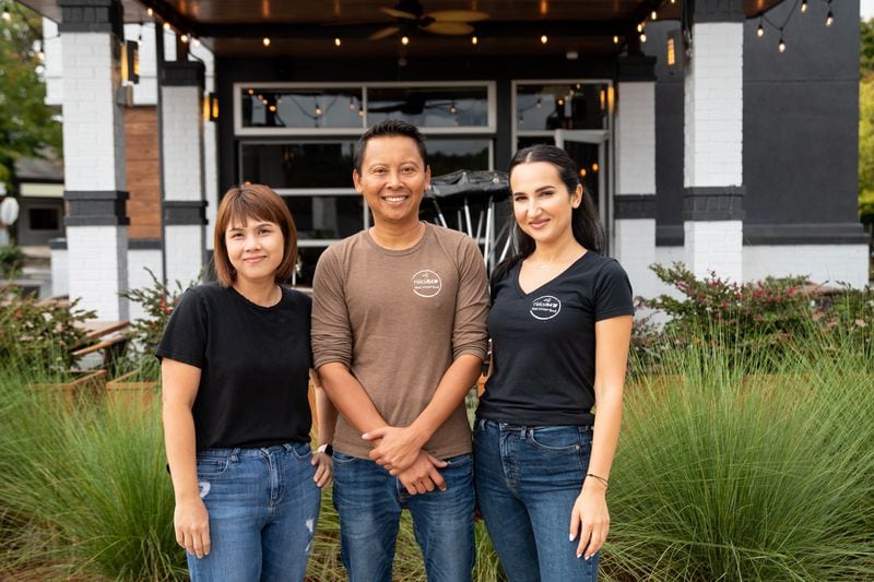 Rickshaw Thai Street Food executive chef Narabhatra Bimbameka (Zea), co-owner Paul Yuwachit, and bar manager and interior designer Tatiana Barburasi. (Mia Yakel for The Atlanta Journal-Constitution)
