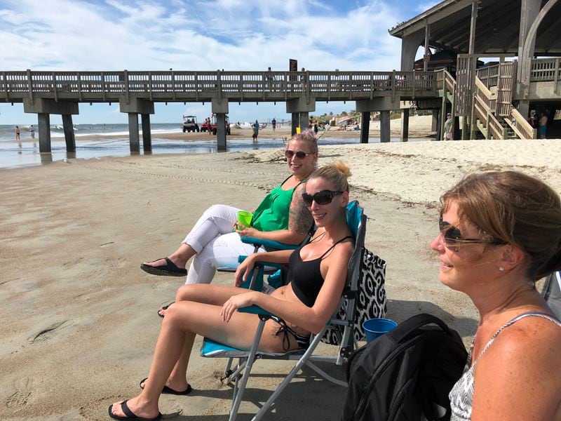Marie Berube, Genevieve Landry and Caroline Loignon relax on Tybee Island waiting for Florence.