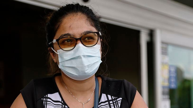 Kruti Pandya of Auburn says that she lives with in-laws in their 80′s, so she is very careful about weaing a mask. Pandya has lost a few members of her extended family to COVID. (Natrice Miller / natrice.miller@ajc.com)