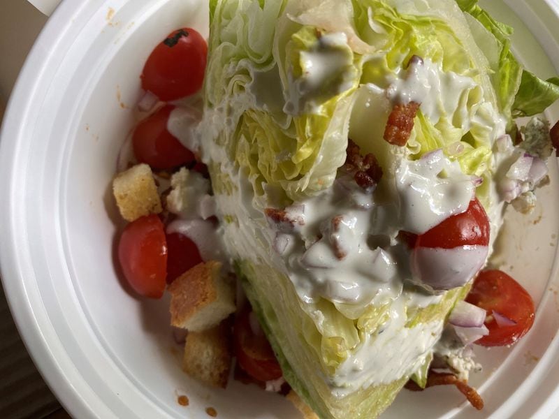 The Two Birds wedge salad is topped with blue cheese dressing and crumbles, chopped bacon, cherry tomatoes and croutons. You can add chicken for $4. CONTRIBUTED BY BOB TOWNSEND