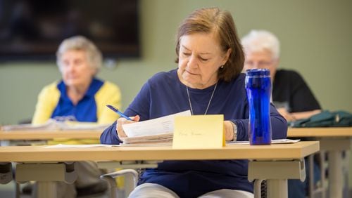 The Central DeKalb Senior Center offers a French culture and language course, where Kris Kane takes instruction from Elizabeth Wilson. (Jenni Girtman / Atlanta Event Photography)
