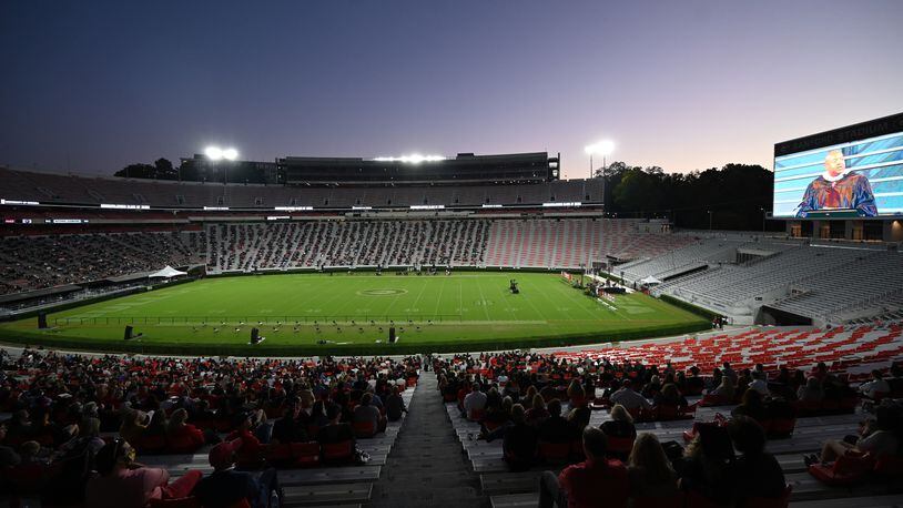 October 16, 2020 Athens - Graduates and their families stay in the stands during the 2020 Spring Undergraduate Commencement ceremony at Sanford Stadium in Athens on Friday, October 16, 2020. (Hyosub Shin / Hyosub.Shin@ajc.com)