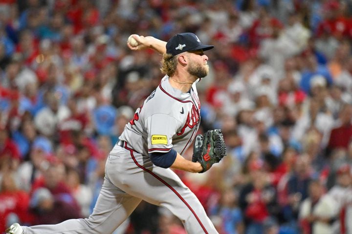 Atlanta Braves relief pitcher A.J. Minter (33) delivers to the Philadelphia Phillies during the sixth inning of NLDS Game 4 at Citizens Bank Park in Philadelphia on Thursday, Oct. 12, 2023.   (Hyosub Shin / Hyosub.Shin@ajc.com)