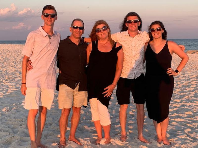 Vickie Portier and her family on a beach vacation in Gulf Shores, Ala. From left: her son Brandon, her husband David, Vickie, her youngest child Luke, and her daughter Julia. Since becoming an empty nester, Portier said, "My relationship with my kids is different but strong. I see them about twice a month. I’m very thankful for technology. I text and or talk to them pretty often, but I try to give them their space. I use to say that I’m retiring (from motherhood), but I soon figured out, that as a mom, we never truly retire."