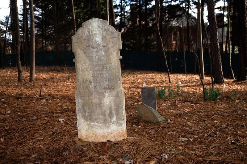 A headstone for April Waters who was enslaved by George Morgan Waters. Credit: STEVE SCHAEFER for The AJC