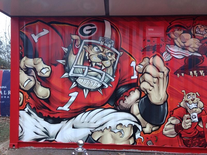Food was distributed from a temporary concession stand decorated with UGA and Auburn illustrations and team colors.