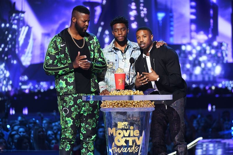 SANTA MONICA, CA - JUNE 16:  (L-R) Actors Winston Duke, Chadwick Boseman, and Michael B. Jordan accept the Best Movie award (Presented by Toyota) for 'Black Panther' onstage during the 2018 MTV Movie And TV Awards at Barker Hangar on June 16, 2018 in Santa Monica, California.  (Photo by Kevin Winter/Getty Images for MTV)