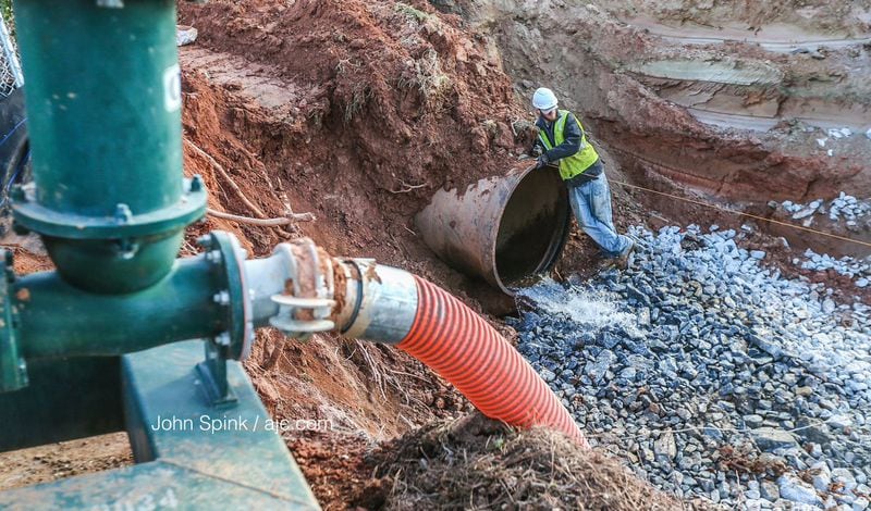 DeKalb County Watershed Management officials expect to complete repairs to a broken water main Friday evening, officials said. JOHN SPINK / JSPINK@AJC.COM