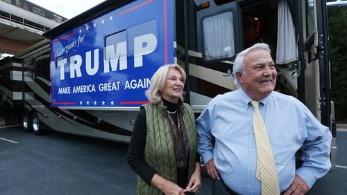 Georgia Public Service Commissioner Lauren "Bubba" McDonald, Jr., a Donald Trump supporter, and his wife Shelley speak to a reporter after arriving in their recreational vehicle at the Corey Center for a watch party on Monday, March 1, 2016, Atlanta. Curtis Compton / ccompton@ajc.com