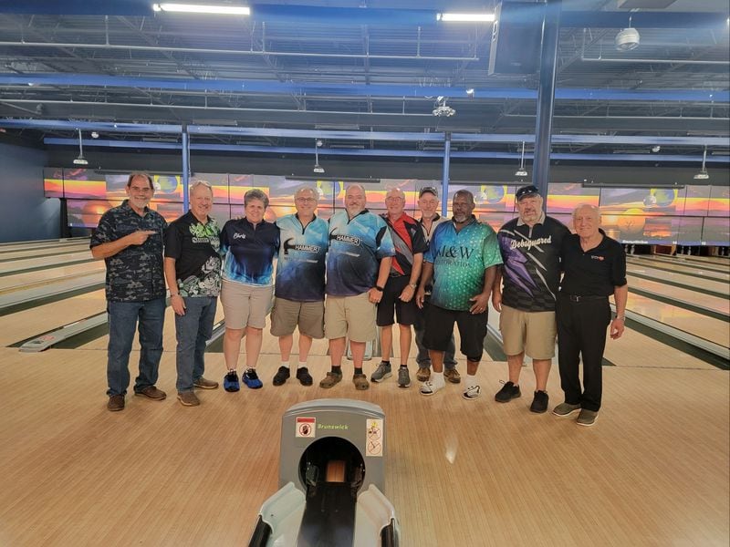 John Restivo, fourth from left, with fellow bowlers he sees during games every Monday night.