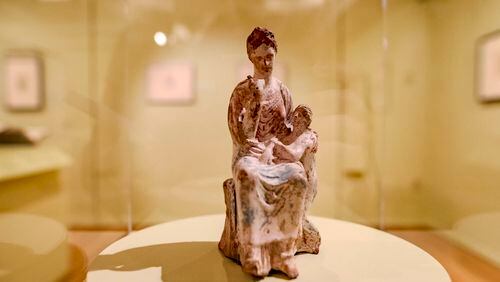 A Tanagra statuette depicting a mother and child on display at the Michael C. Carlos Museum. (Photo Courtesy of Isadora Pennington)
