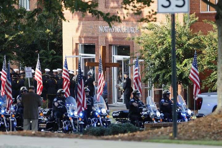 Cobb County Honor Guard awaits on the casket of Deputy Jonathan Koleski to enter the NorthStar Church for his funeral service on Wednesday, September 14, 2022. Miguel Martinez / miguel.martinezjimenez@ajc.com