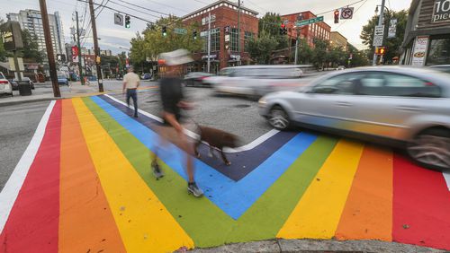 Motorists and pedestrians had a brand new perspective of 10th and Piedmont Avenue in 2015. There was aproject to paint rainbow crosswalks in Midtown for the launch of Atlanta Pride. JOHN SPINK /JSPINK@AJC.COM