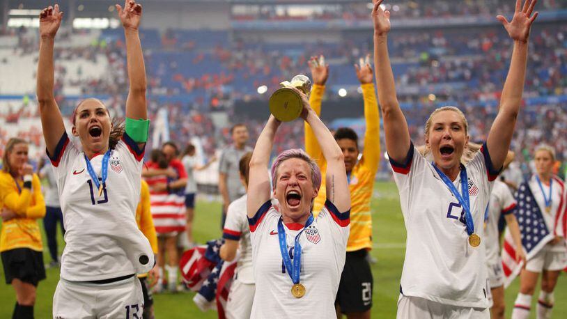 Megan Rapinoe of the USA celebrates with the FIFA Women's World Cup Trophy following her team's victory in the 2019 FIFA Women's World Cup France Final match between The United States of America and The Netherlands.