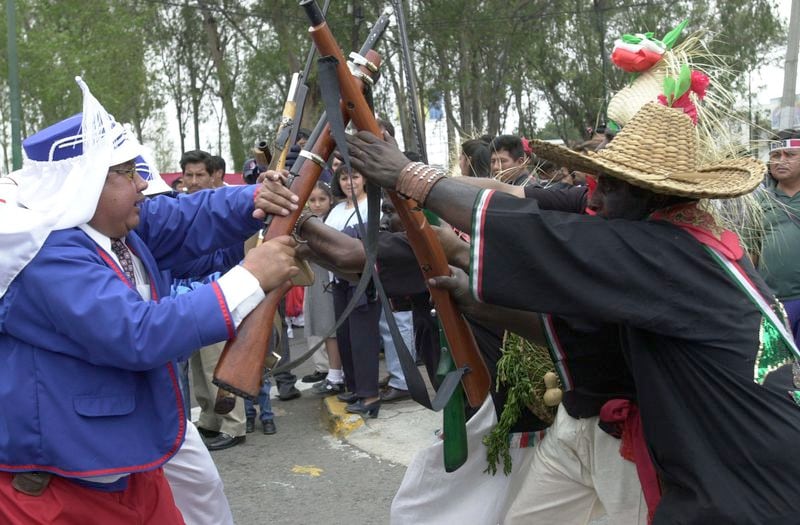 Mexicans celebrate Cinco de Mayo with a reenactment of the 1862 battle between the French and the Zacapuaxtlas Indians May 5, 2001 in Puebla, Mexico.